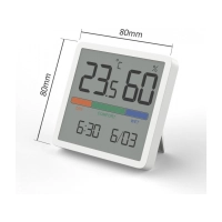 Room thermometer hygrometer on a white table